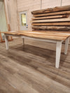 front view of english walnut wood dining table with bookmatched slabs and white epoxy