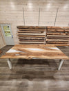 front view of english walnut wood dining table with bookmatched slabs and white epoxy