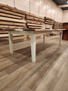 front view of english walnut wood dining table with bookmatched slabs and white epoxy