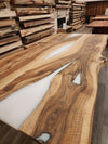 front view of english walnut wood dining table with bookmatched slabs and white epoxy
