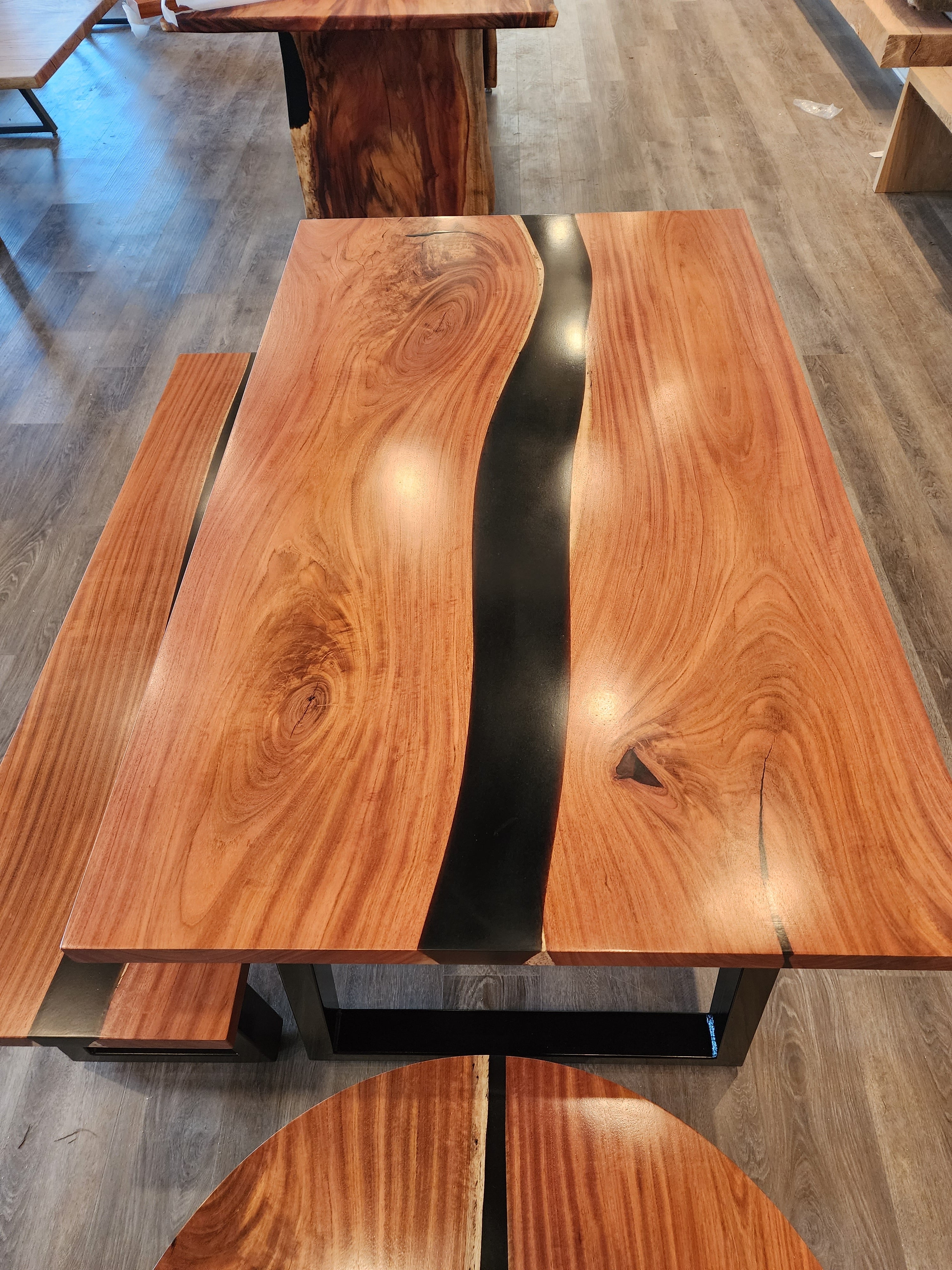 front view of jatoba wood epoxy river dining table set