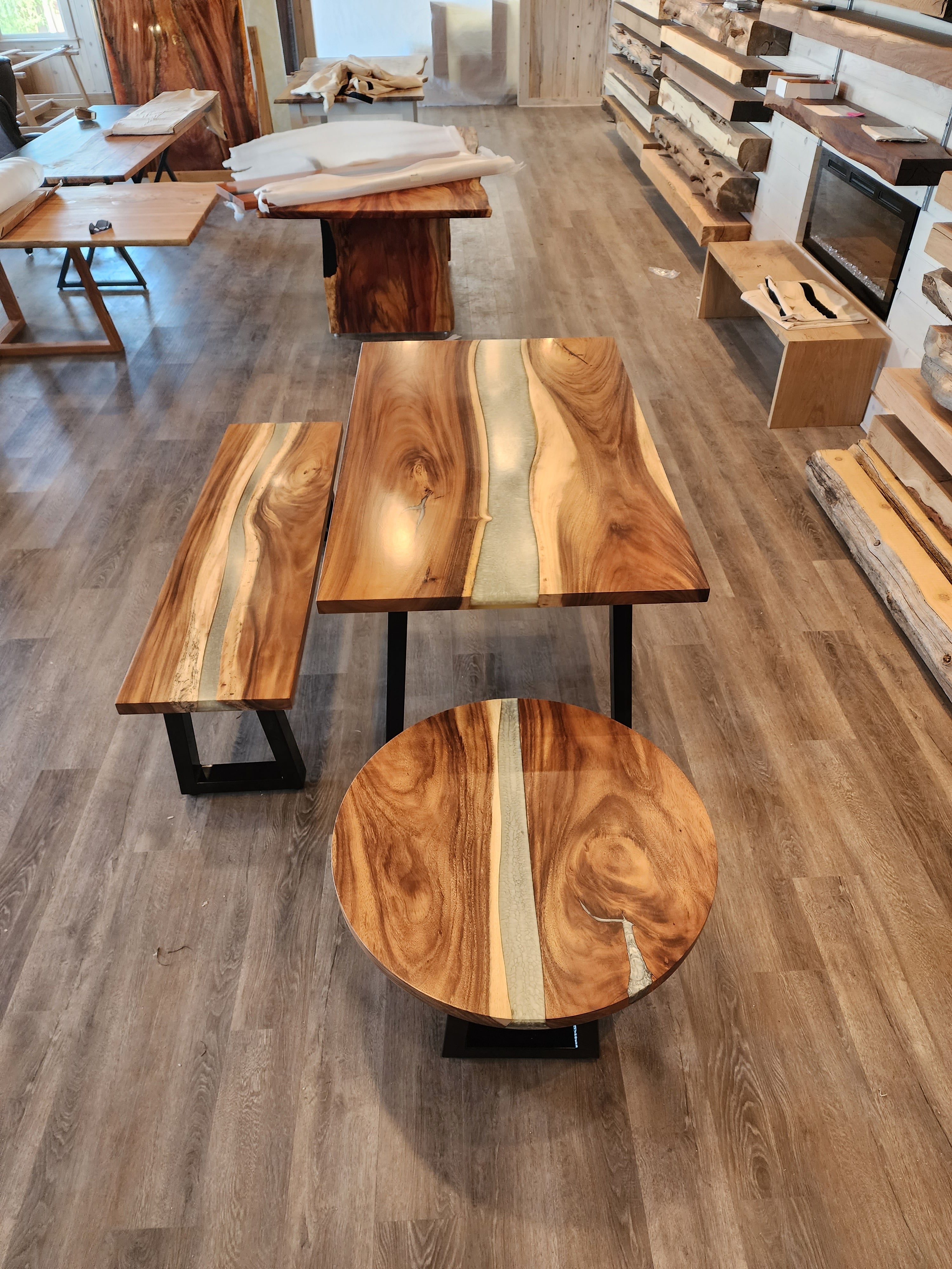 front view of monkey pod epoxy river dining table set