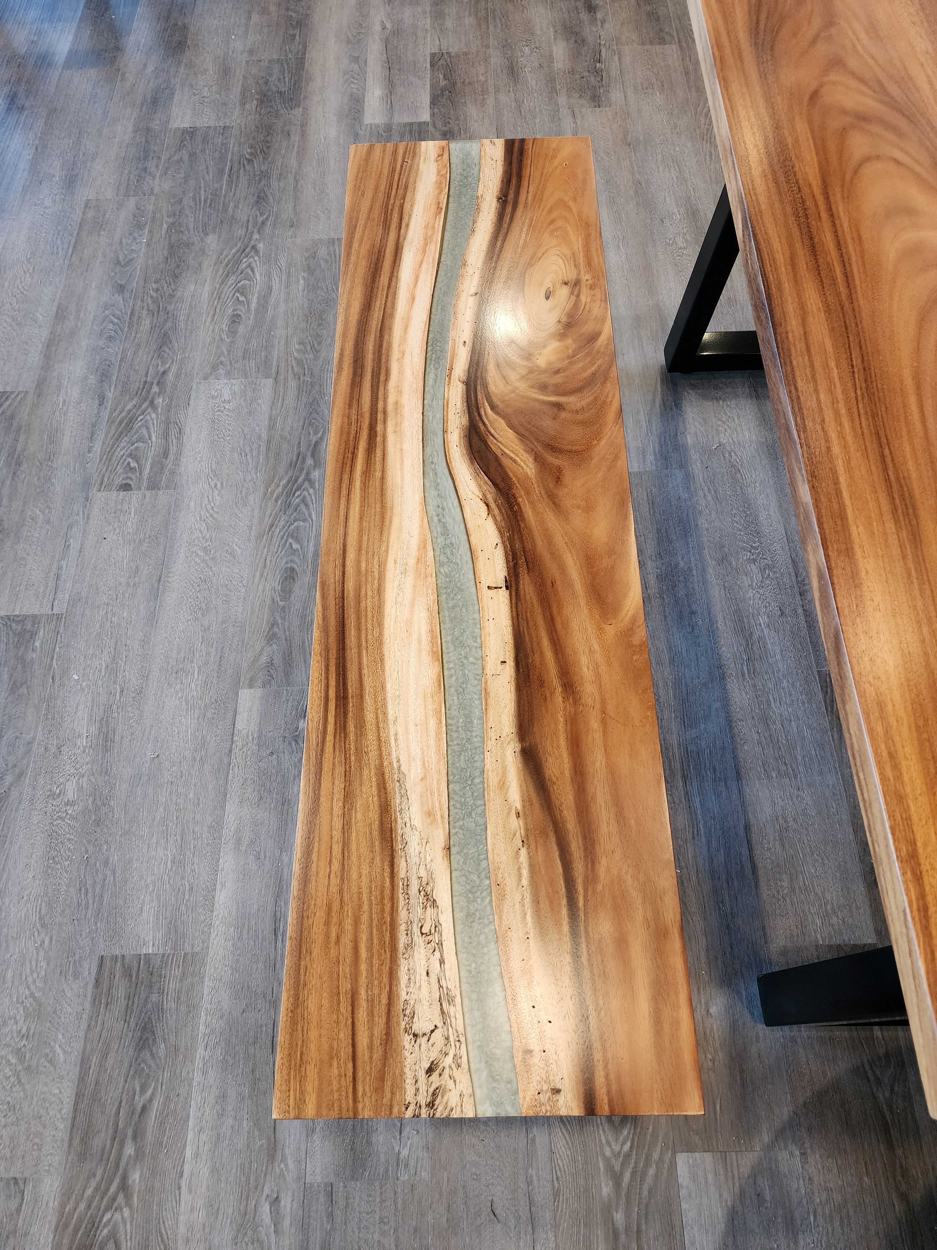 front view of monkey pod epoxy river dining table set