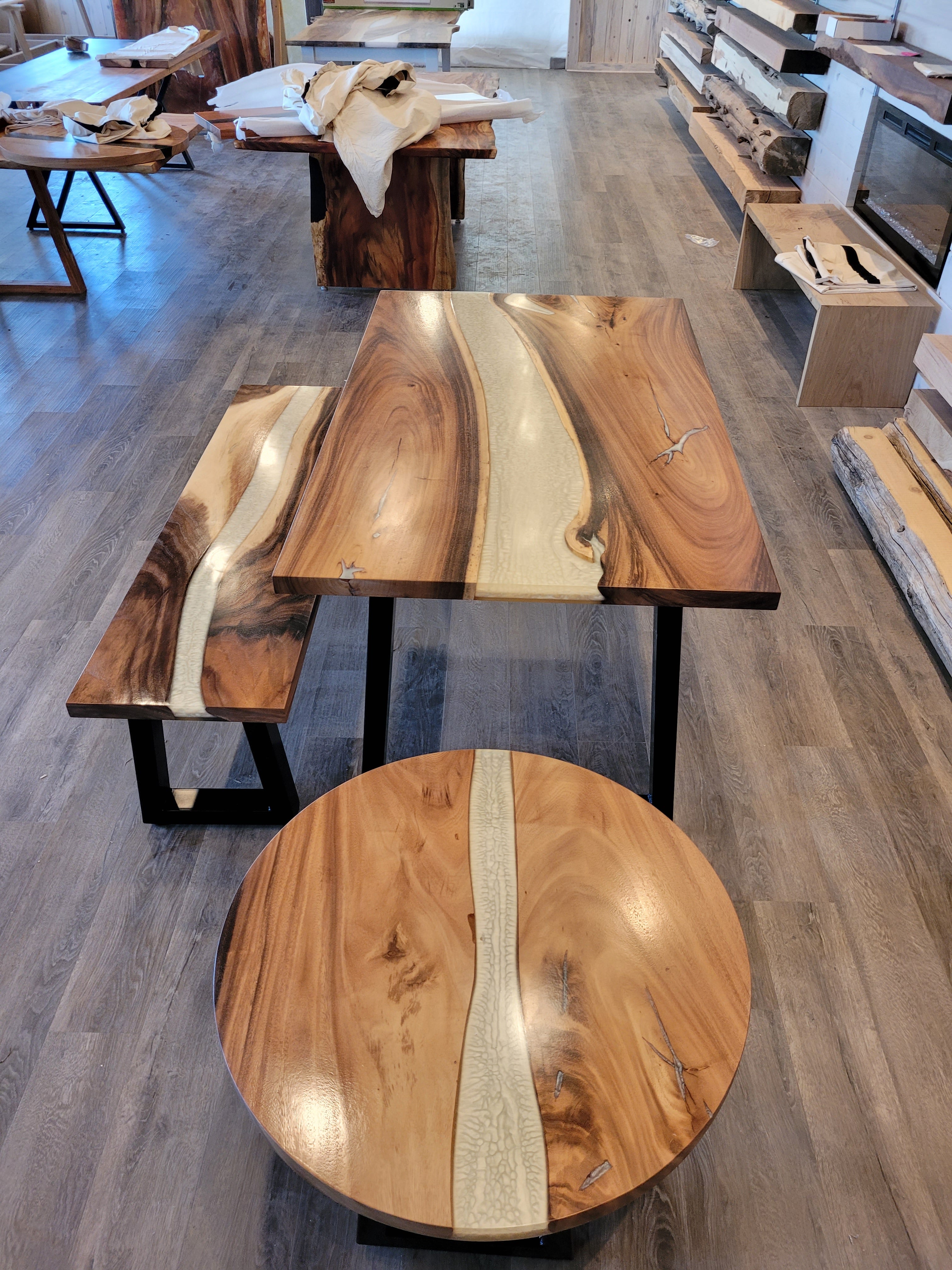 front view of monkey pod wood epoxy river dining table set