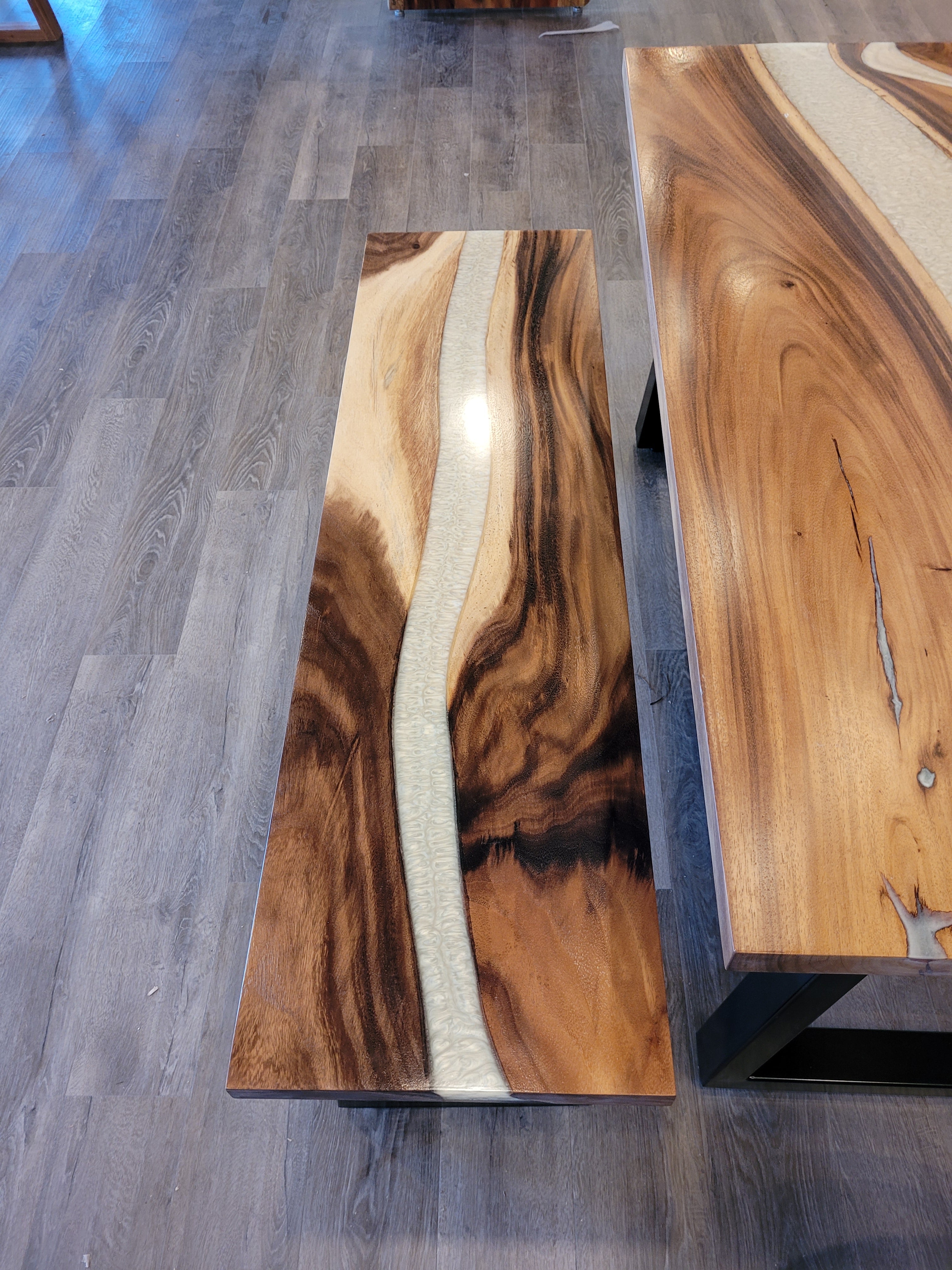 front view of monkey pod wood epoxy river dining table set