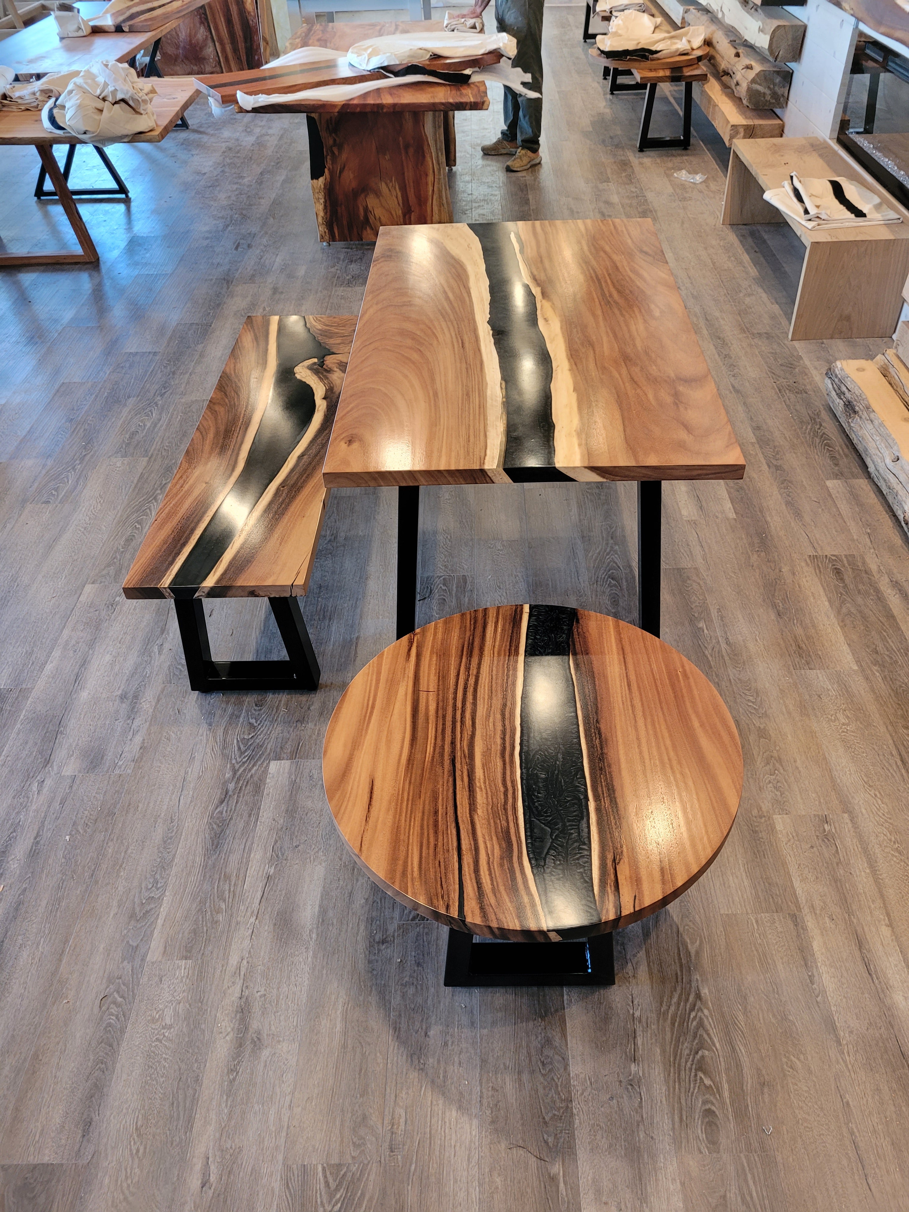 front view of monkey pod wood epoxy river dining table set