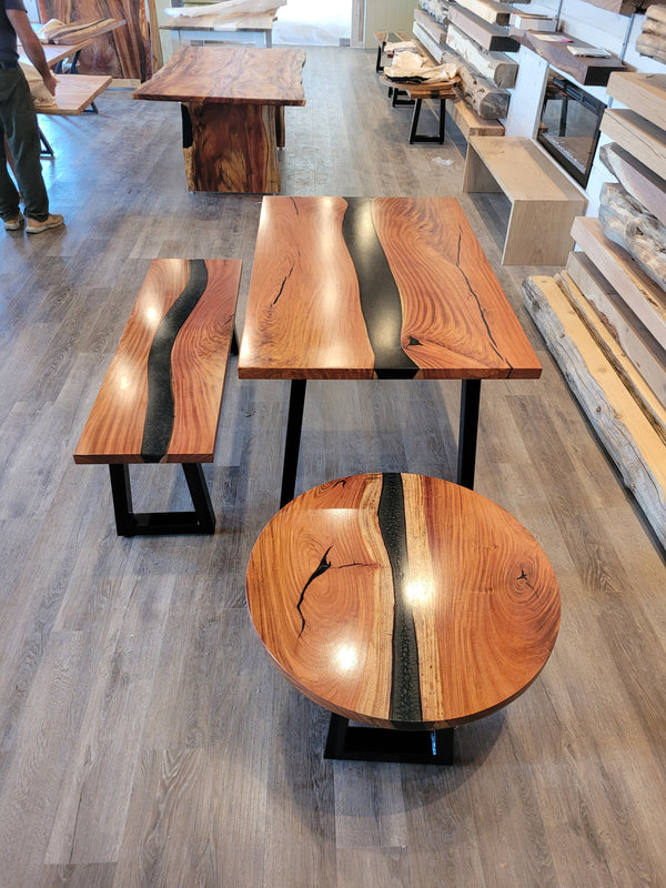 front view of monkey pod wood epoxy river dining table set