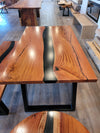 front view of monkey pod wood epoxy river dining table set