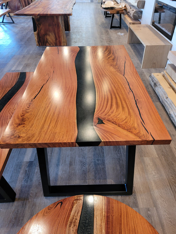 front view of monkey pod wood epoxy river dining table set
