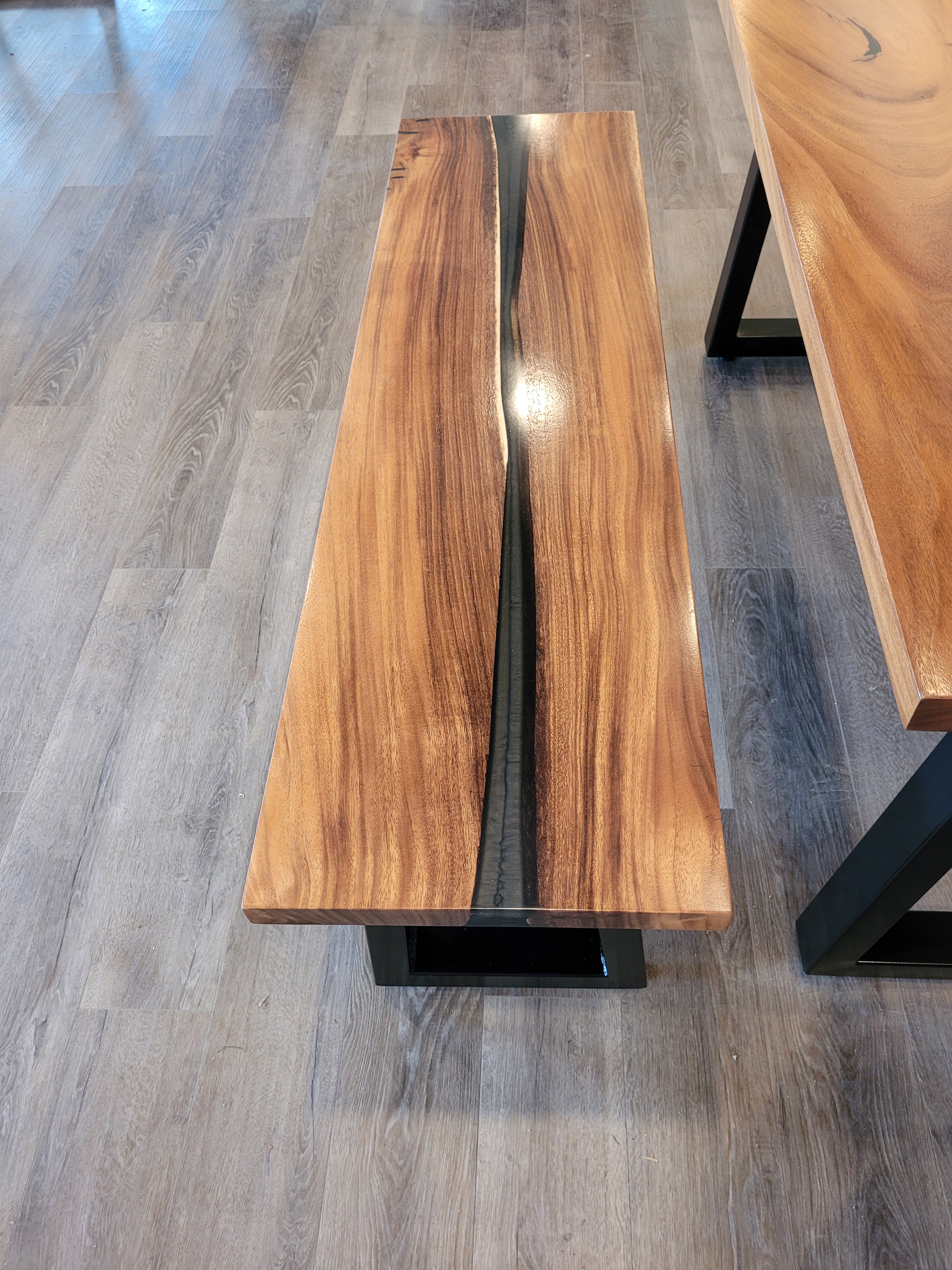 front view of monkey pod wood epoxy river dining table set