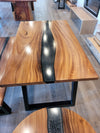 front view of monkey pod wood epoxy river dining table set