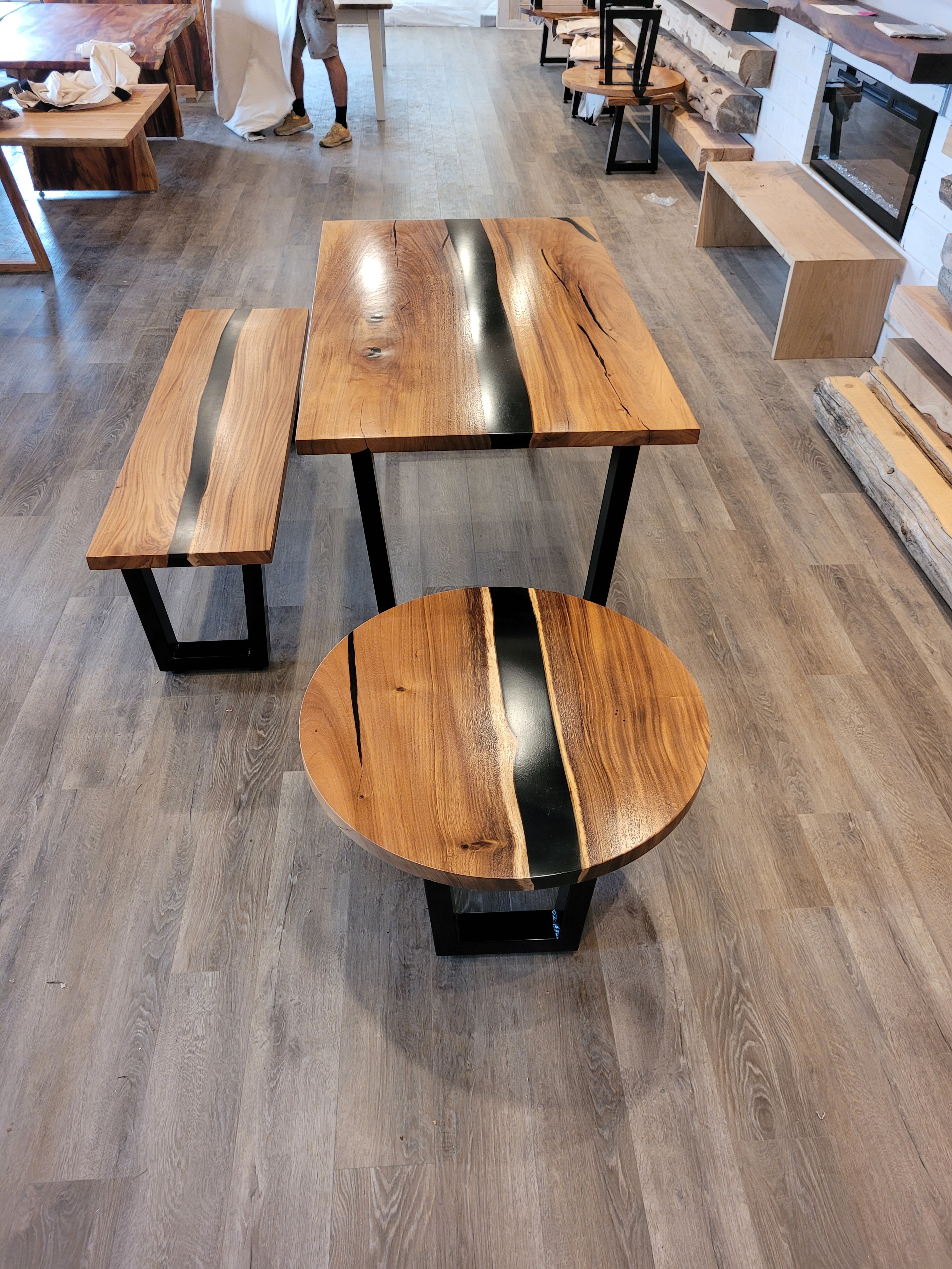 front view of monkey pod wood epoxy river dining table set