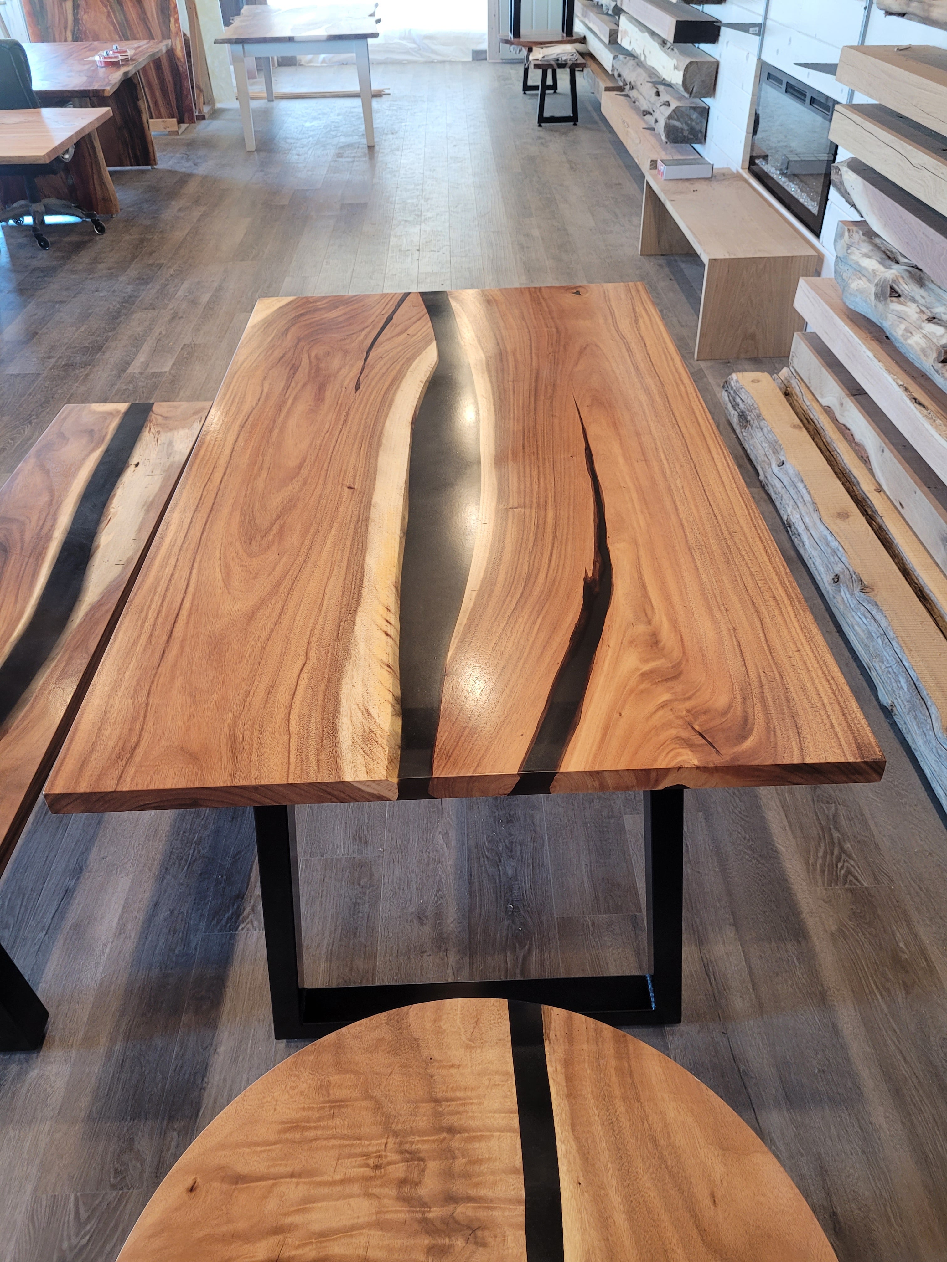 front view of monkey pod wood epoxy river dining table set