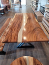 front view of monkey pod wood epoxy river dining table set