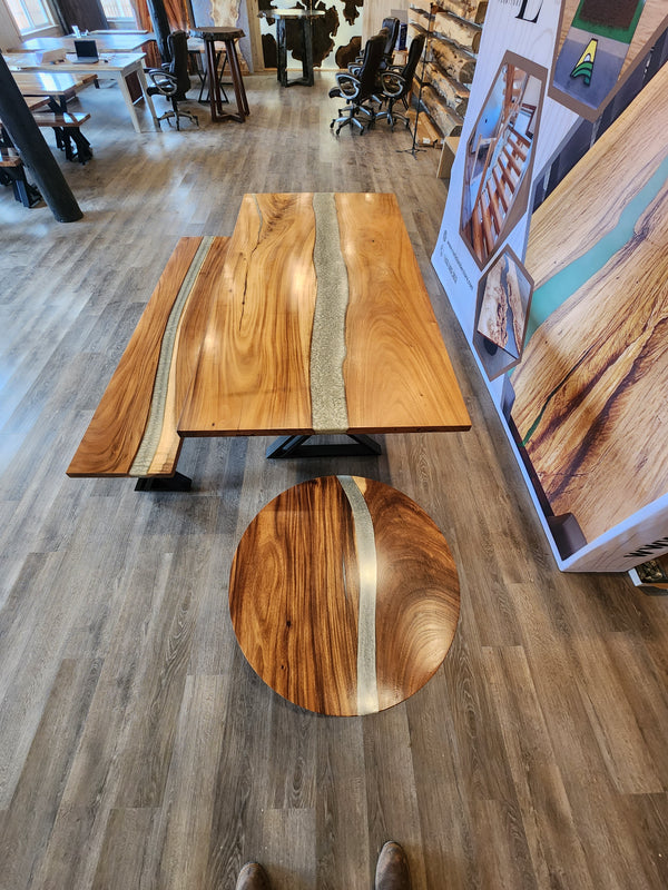 front view of a monkey pod epoxy river table set.