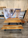 side view of a monkey pod epoxy river dining room table set.