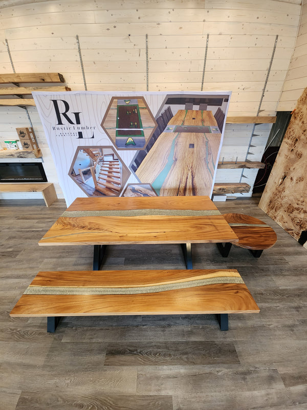 side view of a monkey pod epoxy river dining room table set.